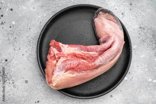 Принти на полотні Whole raw ox tongue with peppercorn seasoning and thyme on plate