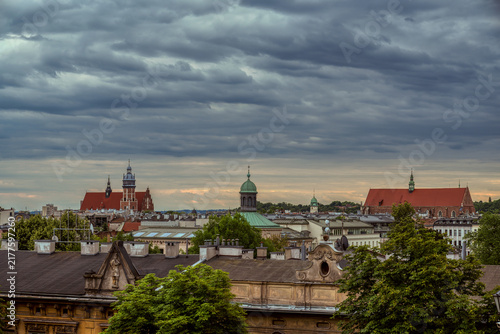 Krakow cityscape with historic church towers and dramatic sky
