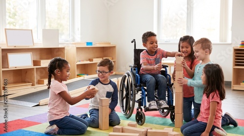 Inclusive Group of Diverse Children Playing with Wooden Blocks in Preschool