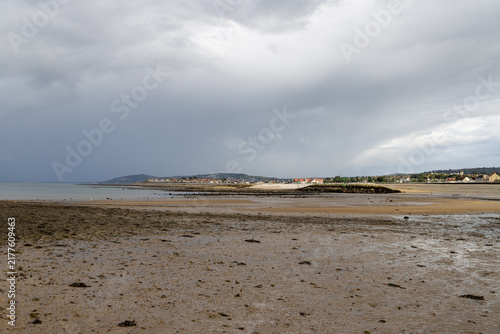 Obraz na plátne Wide view across Penrhyn Bay North Wales at low tide showing exposed wet sand co