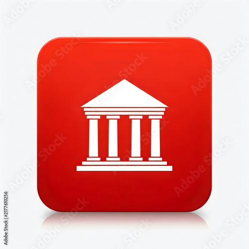Neoclassical building with columns on red background