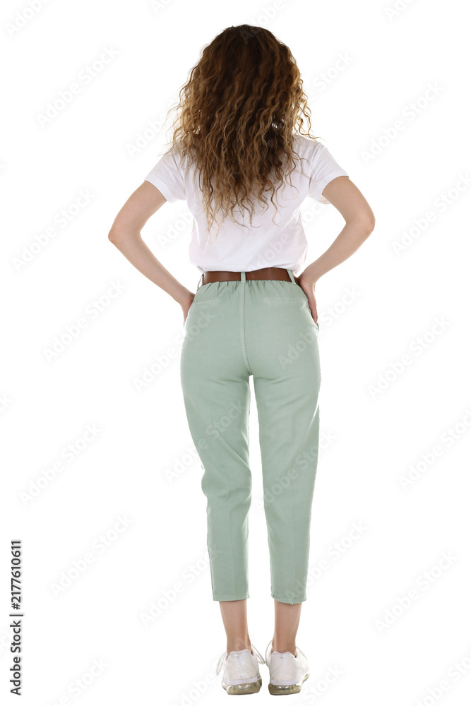 Fototapeta premium Woman wearing pants and t-shirt on white studio background