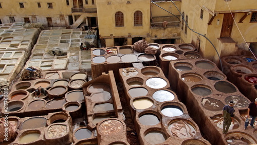 фотографія Vats of chemicals and dyes in the courtyard of the Chouara Tannery in Fez, Moroc