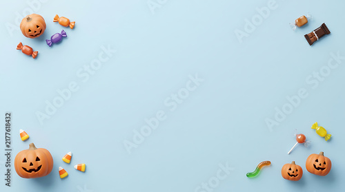 Small pixel art pumpkin and candy decorations frame on a light blue background for Halloween