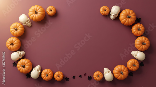 Orange pumpkins and small white skulls arranged in a circle frame on a dark purple background for Halloween