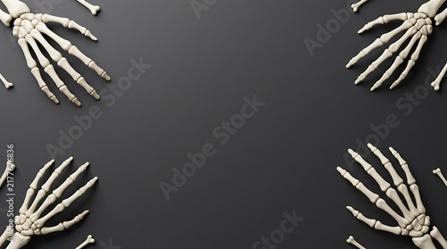 Four human skeleton hands arranged in corners on a dark black background for Halloween design