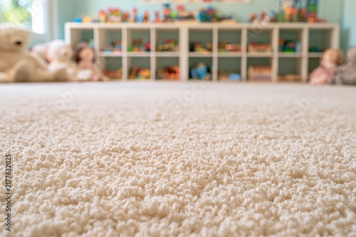 Soft, plush carpet fills foreground of a child's playroom with toys