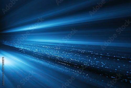Streaks of blue light zoom into distance with bokeh effect