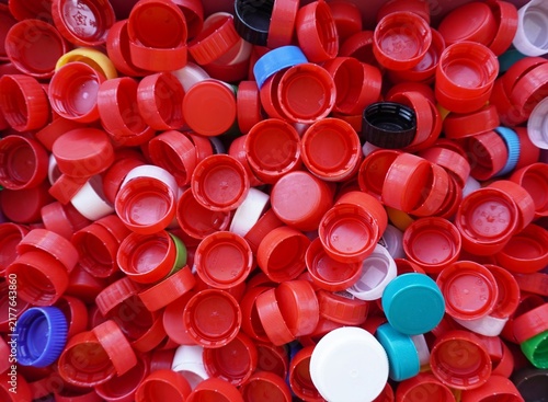 фотографія A bunch of colorful plastic bottle caps, the concept of recycling, environmental pollution, a background of plastic waste