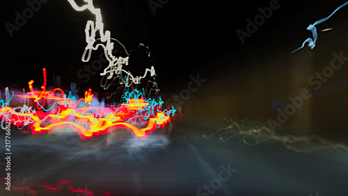 Fotografie An intentional night-time motion-blur shot of a city street with cars