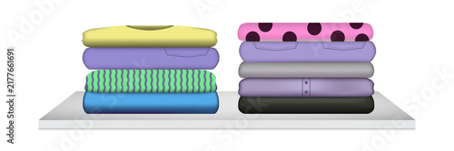 Bild auf Leinwand Colorful folded clothes on white shelf transparent background