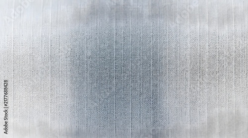 Gray woven fabric macro texture with subtle vertical threads creating a soft neutral textile background pattern
