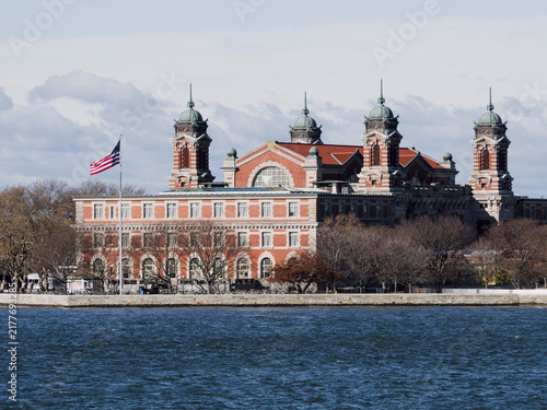 Bild auf Leinwand Ellis Island National Museum of Immigration Across New York Harbor