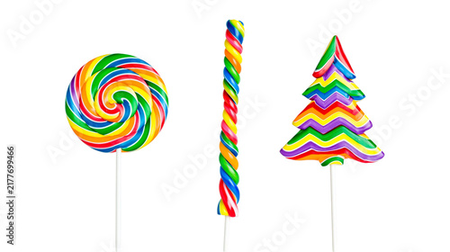 Bild auf Leinwand Isolated colorful sweet rainbow lollipops and striped candies, festive sugary tr