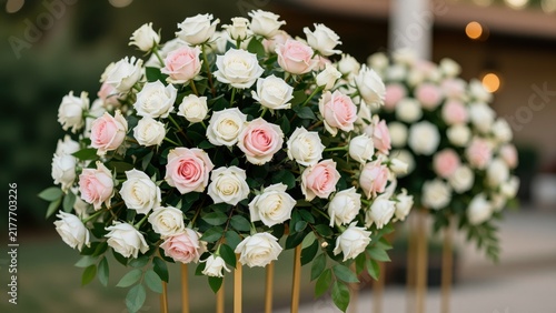 Elegant floral arrangement featuring pink and white roses in a round bouquet for special occasions and decorative displays