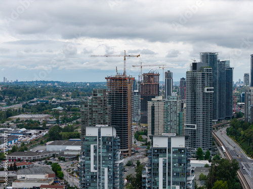 Construction Skyline Over Burnaby High-Rise Towers With Cranes and Cloudy Sky in Greater Vancouver