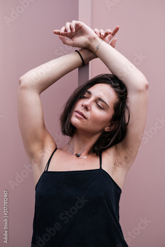 Photography Woman posing with arms crossed on pink background