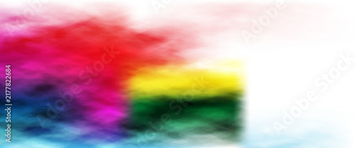 Freeze motion of colorful  painted powder exploding  on white background. Abstract design of color dust cloud. Particles explosion. Splash of colorful painted powder on white background.