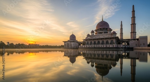Majestic mosque at golden hour by water