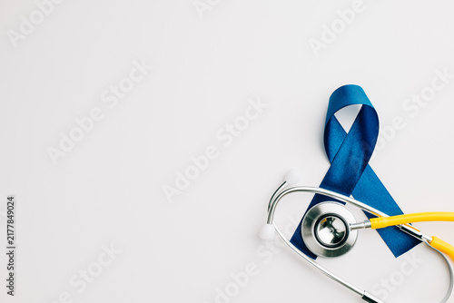 Bild auf Leinwand stethoscope and an awareness blue ribbon symbolize the importance of men's healt