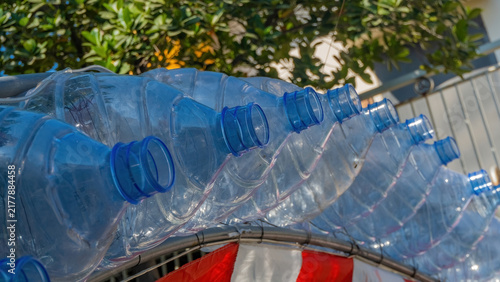 фотографія Recycled plastic water bottle decorations hanging outside during the vibrant fes
