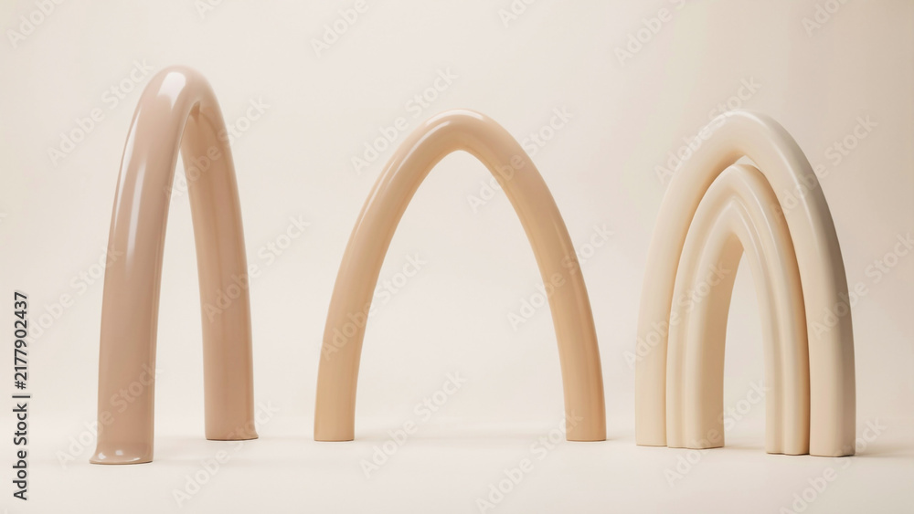 Fototapeta premium Beige arch shaped sculptures arranged on a neutral light background