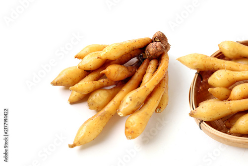 Fotografie Fresh fingerroot on a white background.