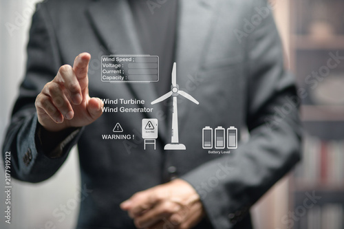 Businessman Interacting with Transparent Digital Wind Turbine and Data Display