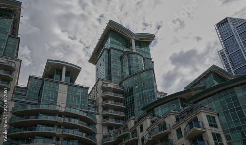 Photography Contemporary residential architecture featuring curved glass balconies and modern design along the River Thames waterfront in London, England