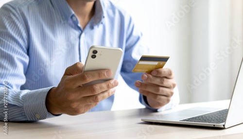 Obraz na płótnie Man using smartphone and credit card for online shopping and digital payment