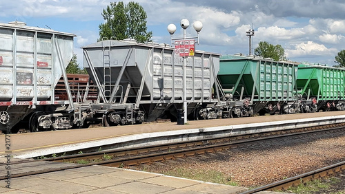 Obraz na plátně Freight train wagons standing on railway tracks at a railway station