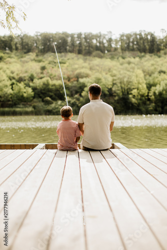 фотографія Quality time by the calm lake, sharing moments and fishing together