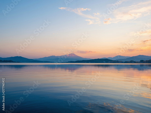 Sunset view of Mount Fuji from a calm lake