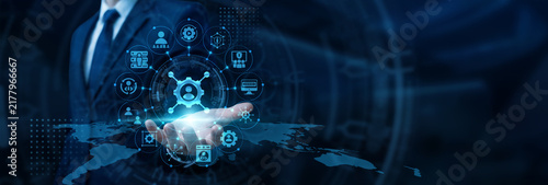 Foto IT specialist hand holding digital console configuring server connectivity for Network Administration tasks and system stability