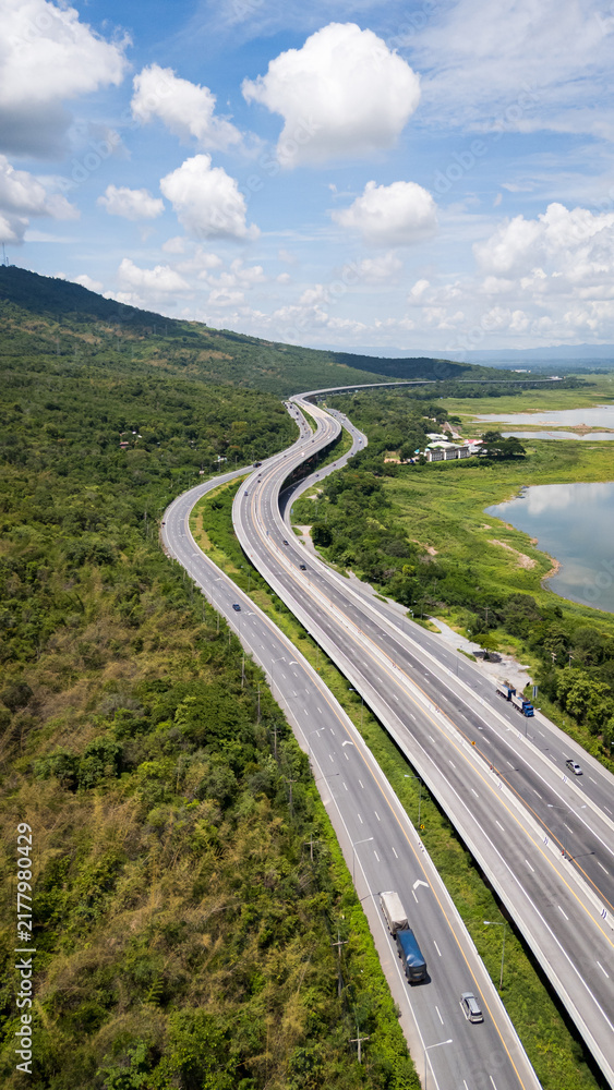 Obraz premium Drone shot The M6 motorway Nakhon Ratchasima Province - Bang Pa-in Lam Ta Khong River and Mountain. Motorway Korat Thailand