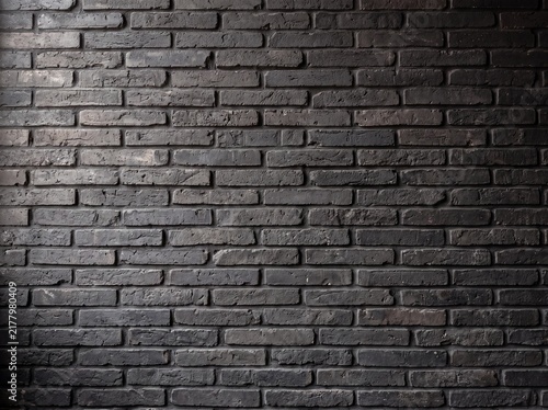 Dark charcoal brick wall texture, industrial black masonry background, moody weathered brickwork for interior design and architectural mockups