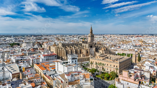 Aerial drone view of Seville cityscape, Seville city center with traditional houses and streets historic architecture, urban landscape of old town, Andalusia, Spain