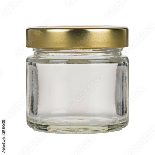 Small empty clear glass jar with a brushed gold metal screw lid isolated on a transparent background