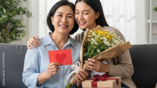 Happy Asian Mother and Daughter Celebrating Together