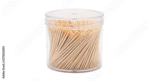 Foto Clear plastic container filled with many wooden toothpicks on a white background