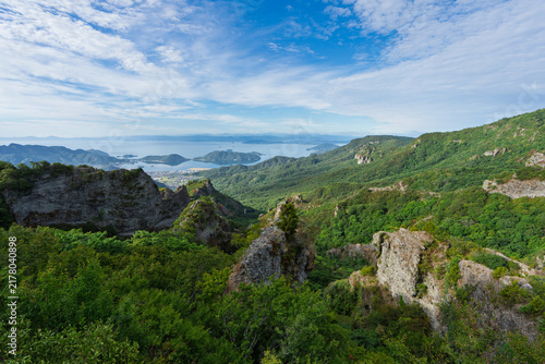View of steep rock cliffs of Kankakei Gorge and peaceful bay on Shodoshima Island