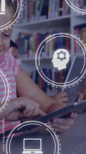 Children using tablets in library with educational icons overlay animation