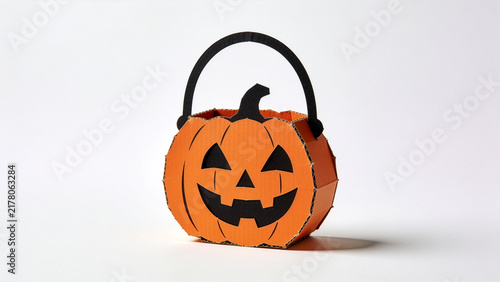 Orange and black cardboard Halloween pumpkin candy bucket
