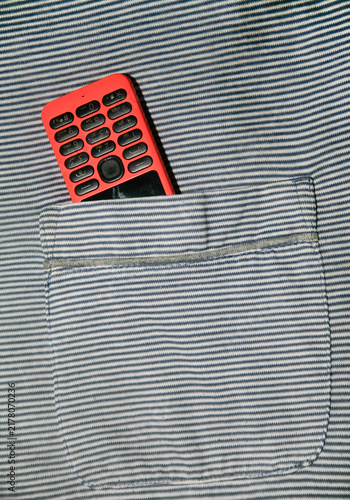 Canvas Print Close up of dumb phone on shirt pocket