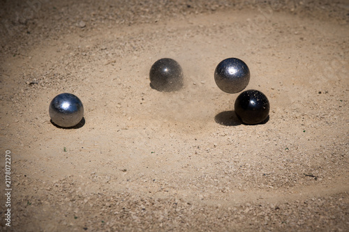 Petanque Metal Boule Hitting Ground with Dust Splash Outdoor Game Action