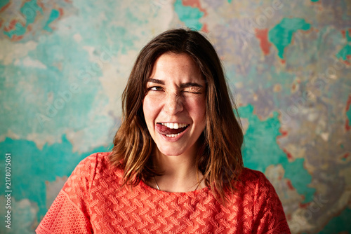 фотографія Character, woman and tongue out on damaged wall for theater improvisation or acting class