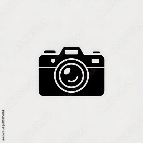 Black photo camera icon on a white background