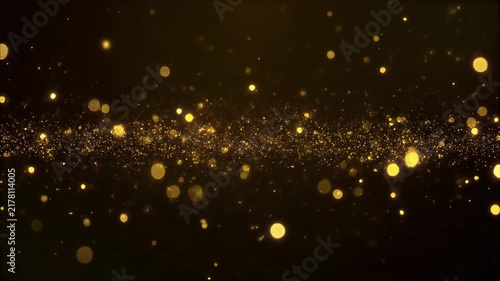 A dynamic and shimmering display of golden particles and bokeh lights.