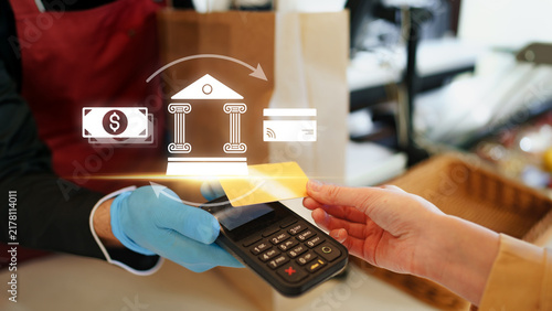 Bild auf Leinwand Online payment process at a store with cash and card transaction during a busy s
