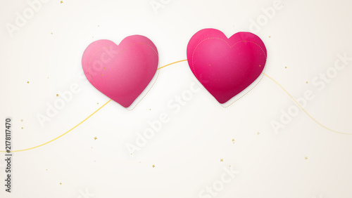 Two Pink Hearts Suspended on a Golden String Symbolizing Romantic Connection and Valentine Day Celebration